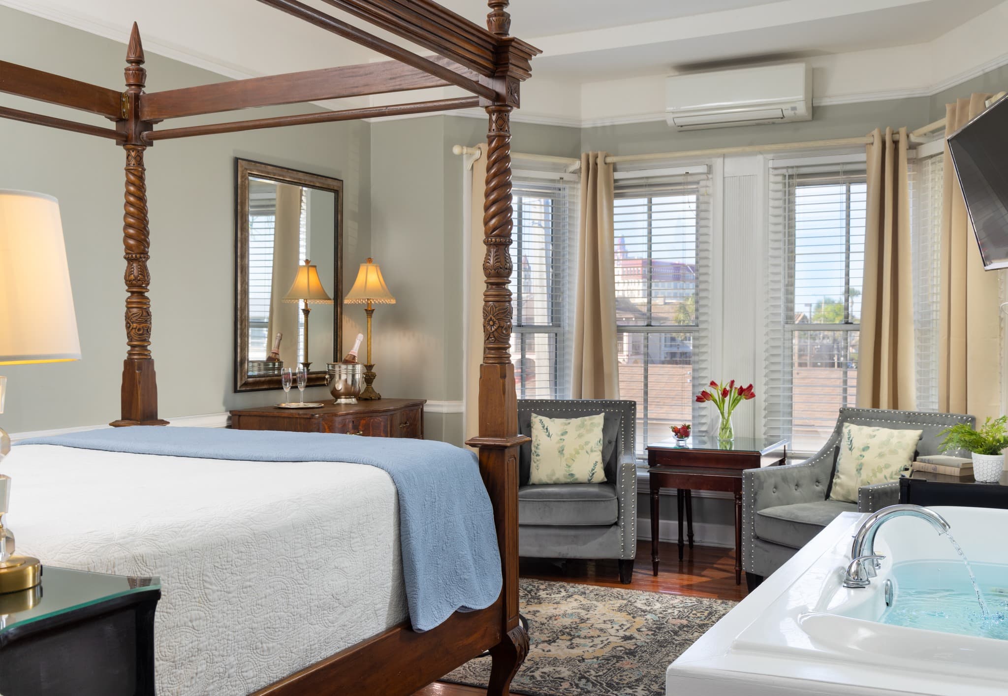 grey room with tub and sitting area