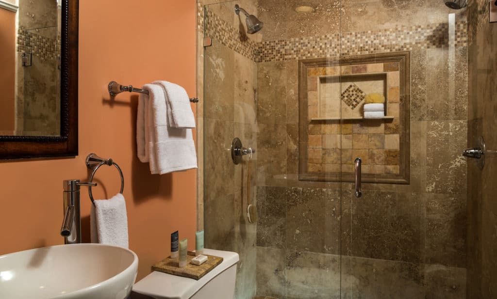 tiled shower with vessel sink