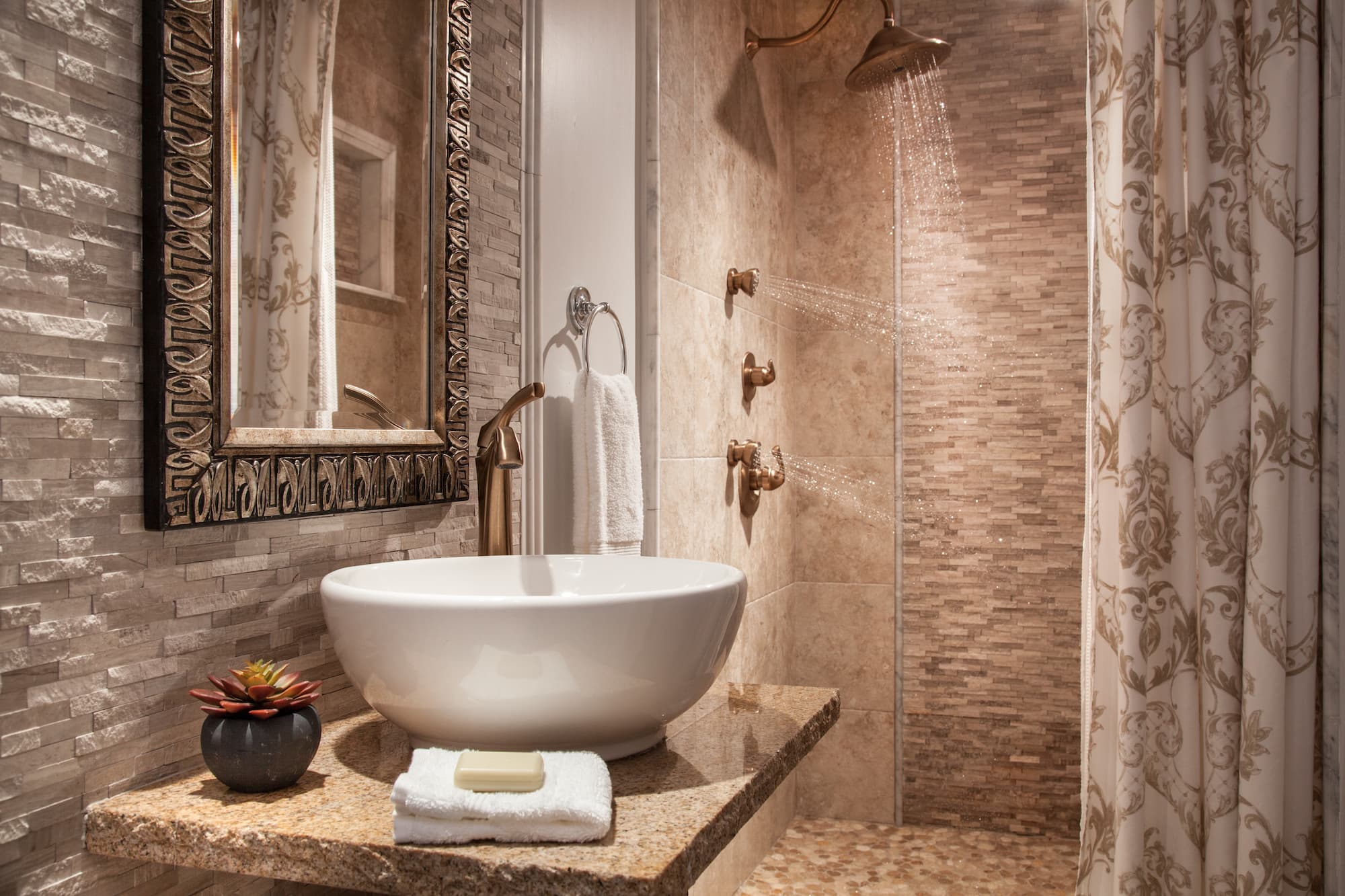 tiled bathroom with vessel sink