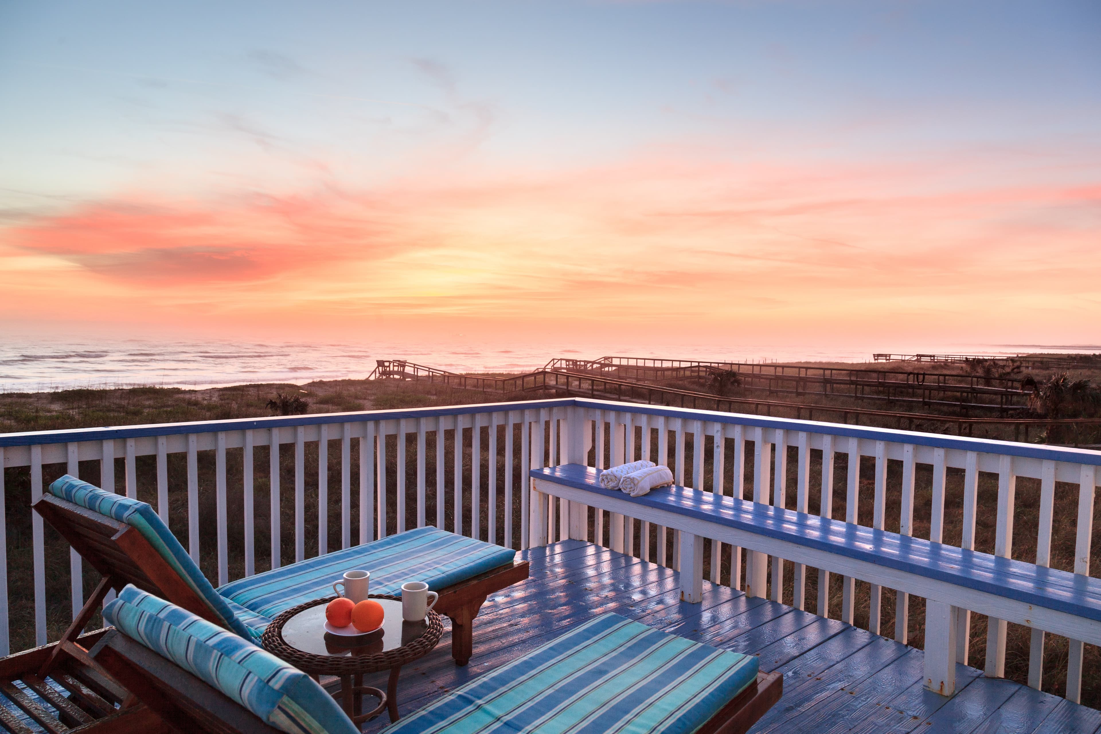 outdoor deck two chaise lounges ocean view