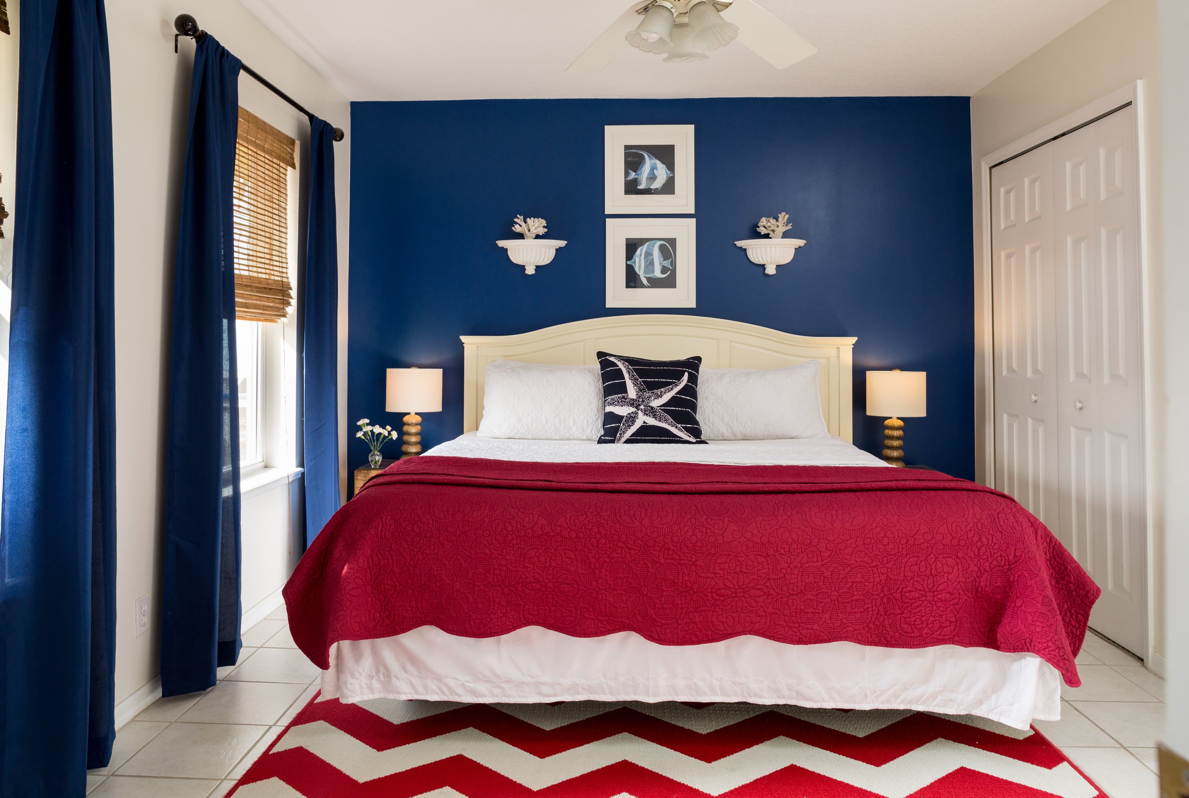 blue bedroom with red comforter