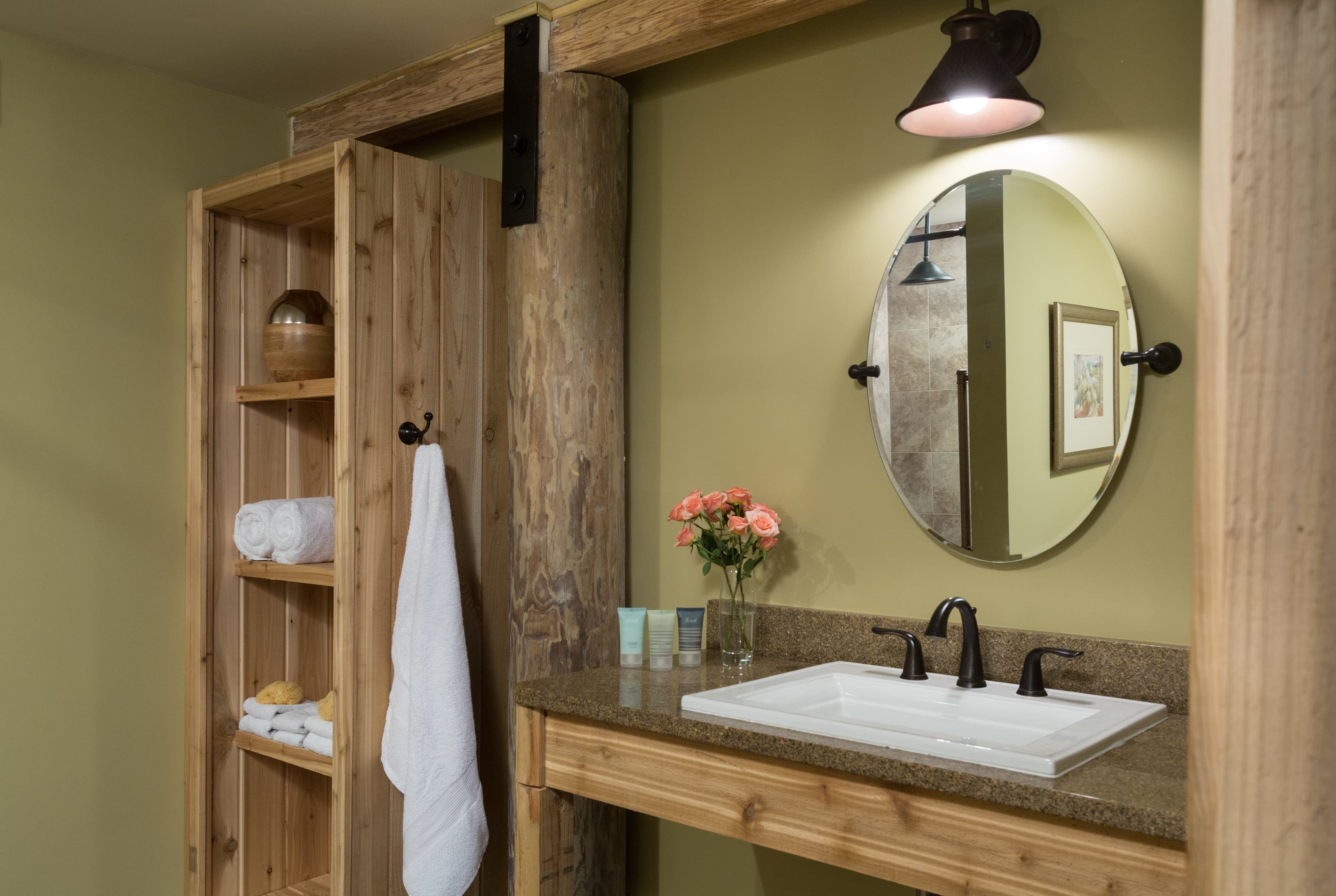 sink and shelving oval mirror