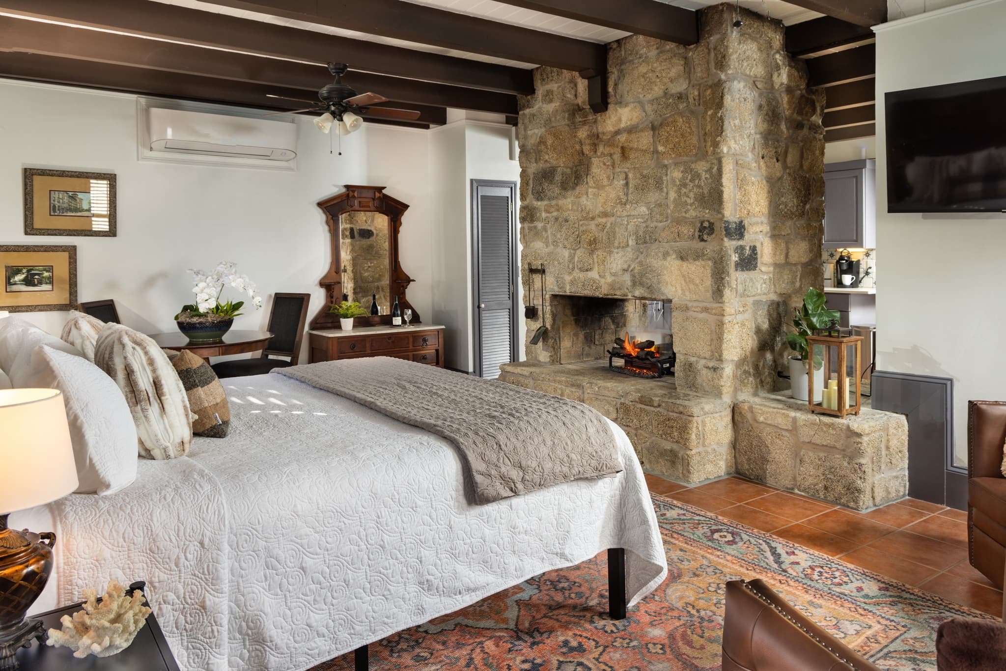 Large bedroom with stone fireplace in St Augustine