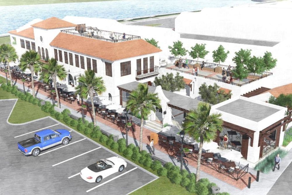 Aerial rendering of a modern restaurant with outdoor seating and palm trees, overlooking a waterway.