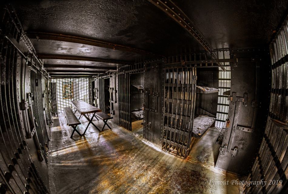 Close up view of bars and wire at a jail