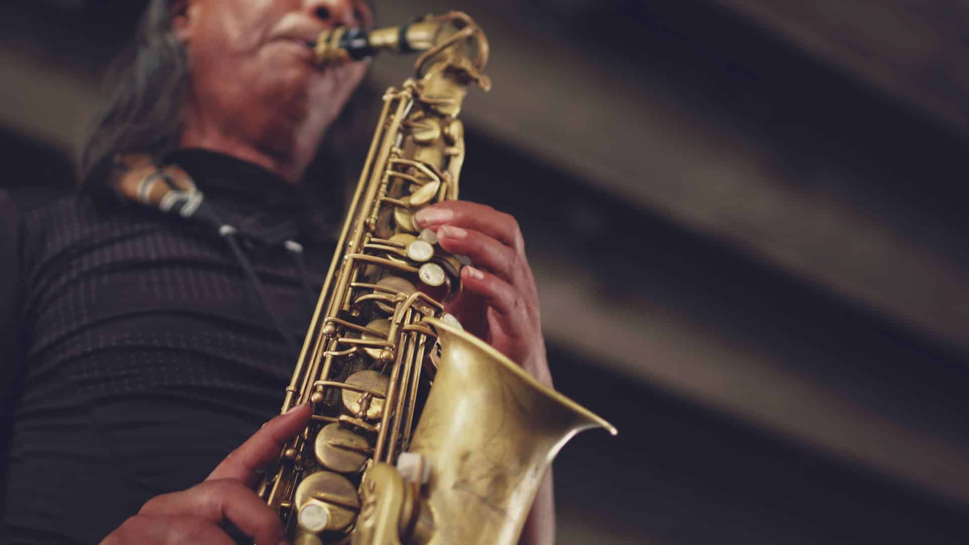 Close up view of man playing a saxophone
