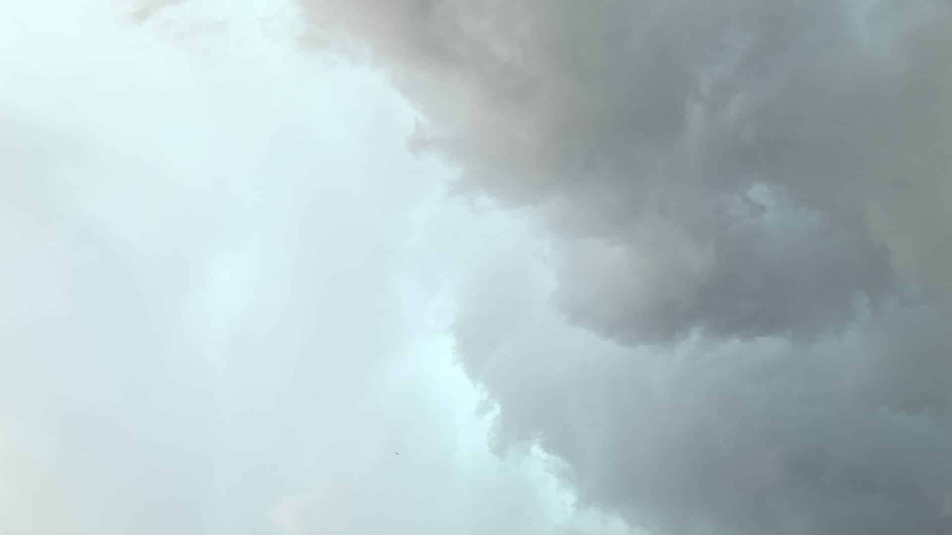 Close up view of light blue and dark gray storm clouds