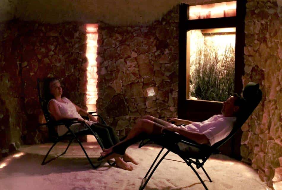 Two people sitting in lounge chairs enjoying a salt spa