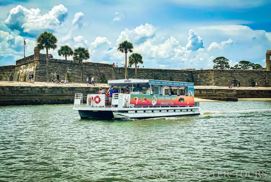 Water tour boat on the water with old fort in the background